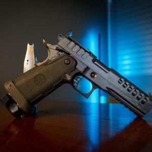 Watchtower Demolitia 9mm pistol on wood table, right angle