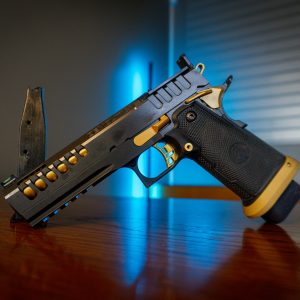 Watchtower Demolitia 9mm pistol on wood table, left angle