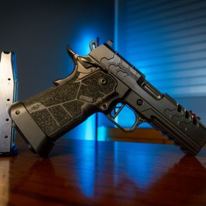 Kimber 2K11 Pro Comp pistol on wood table, left angle