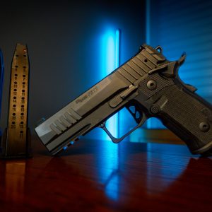 Sig Sauer P211 GT4 pistol on wood table, left angle