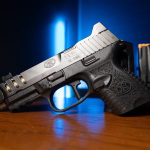 FN 509 CC Edge 9mm pistol with silver slide and magazines