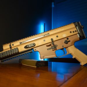 FN SCAR 15P 5.56 pistol in FDE, left side on wood table