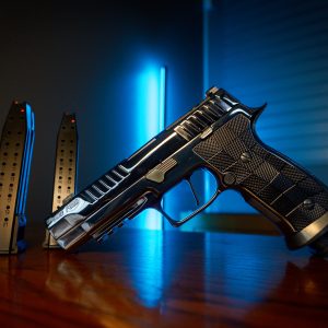 Sig Sauer P320 Reserve 9mm pistol with magazines, left angle