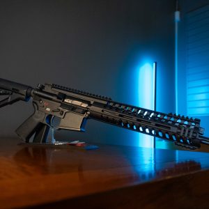 POF P-415 5.56 rifle, left side on wood table