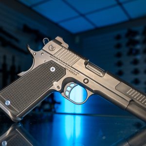 Nighthawk Custom Envoy 9mm pistol on glass counter, right angle