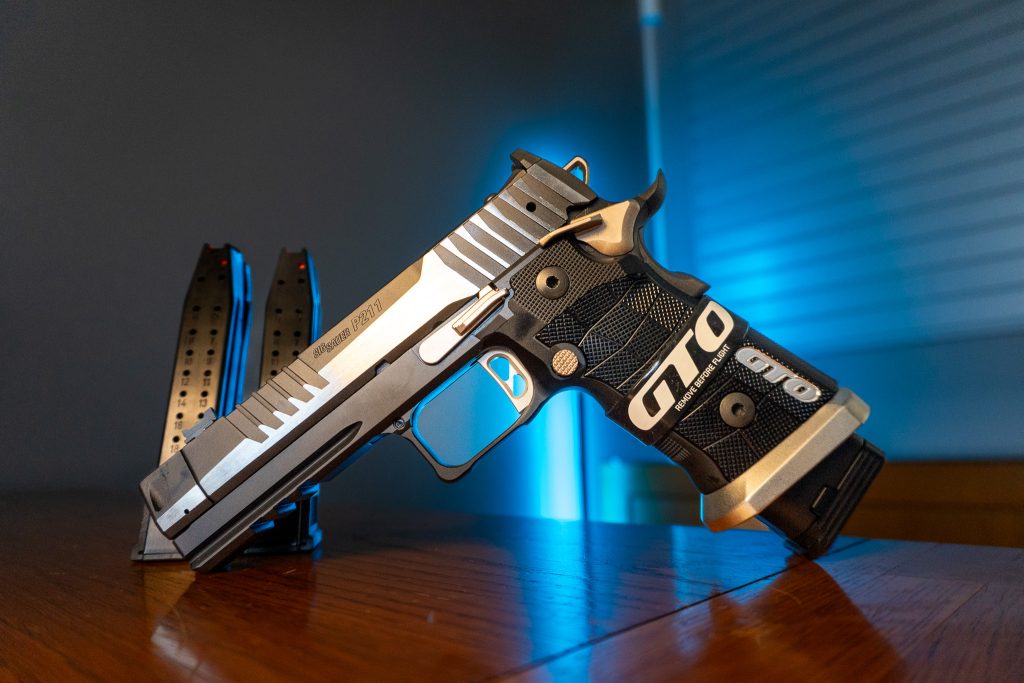 Sig Sauer P211 GTO Equinox 9mm pistol with two-tone slide and magazines, right side