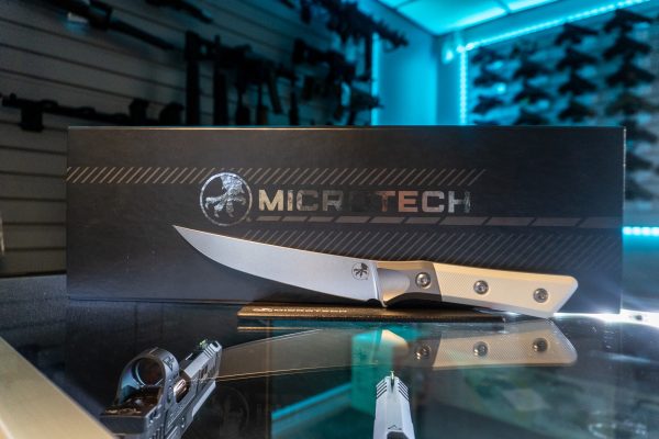 Microtech boning knife with ivory G-10 handle in display box