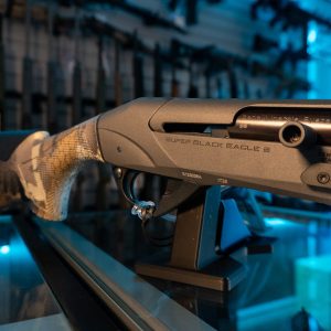 Close-up of Benelli Super Black Eagle 3 receiver and camo stock