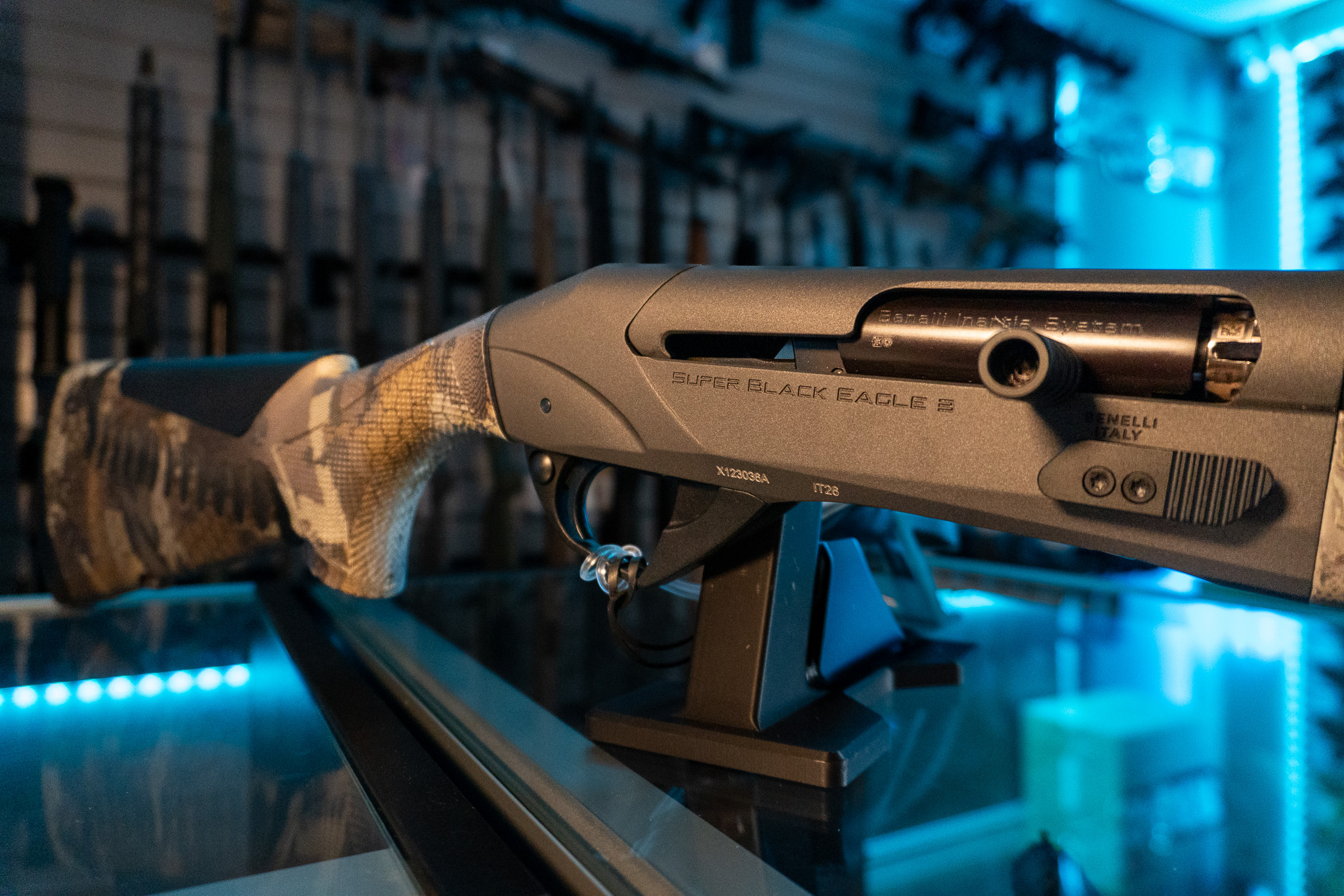 Close-up of Benelli Super Black Eagle 3 receiver and camo stock