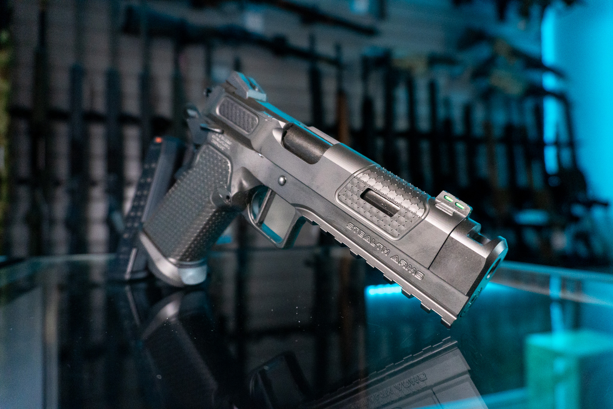 Stealth Arms Platypus 17 9mm pistol on glass counter, front angle