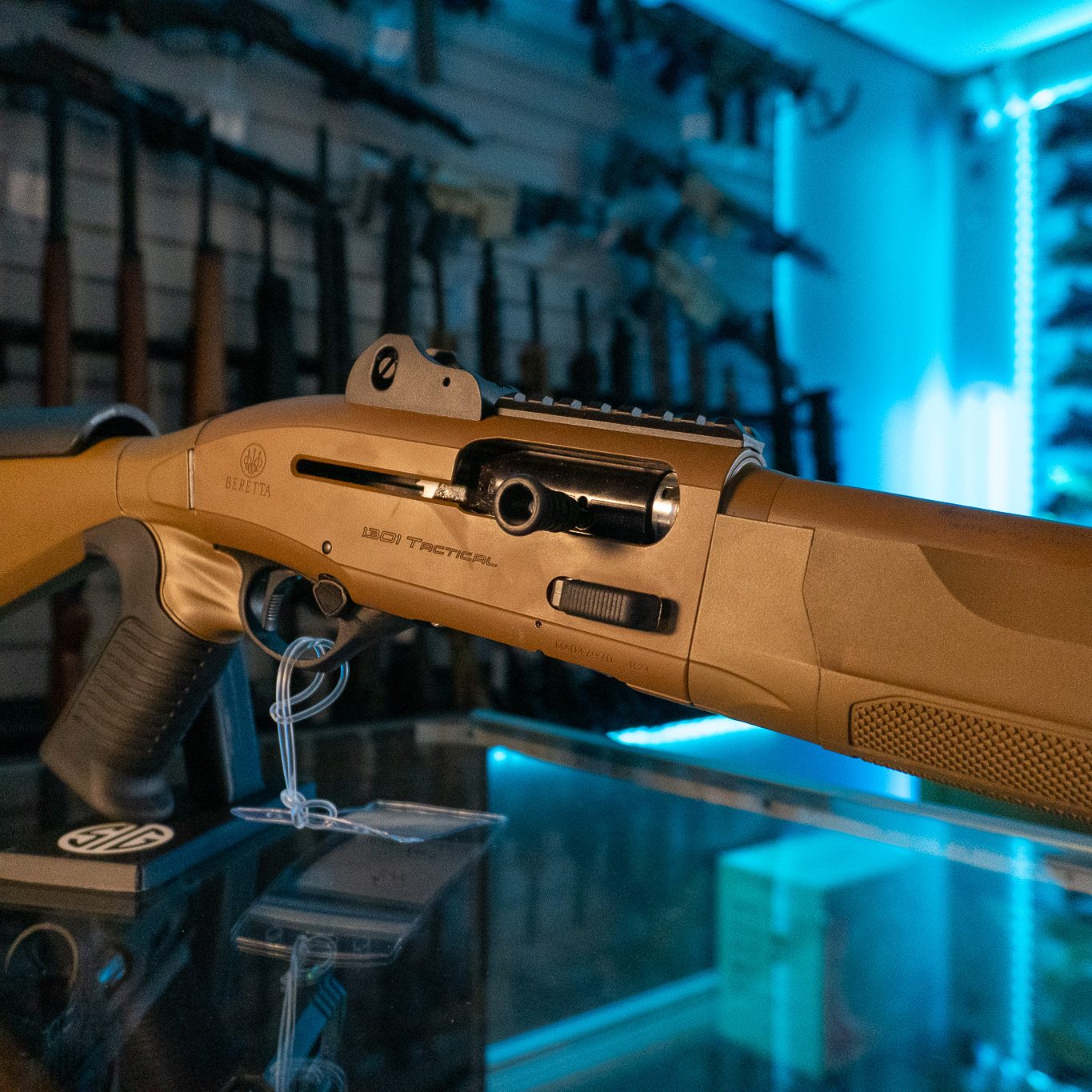 Side view of the Beretta 1301 Tactical Mod 2 FDE receiver, pistol grip and textured forend