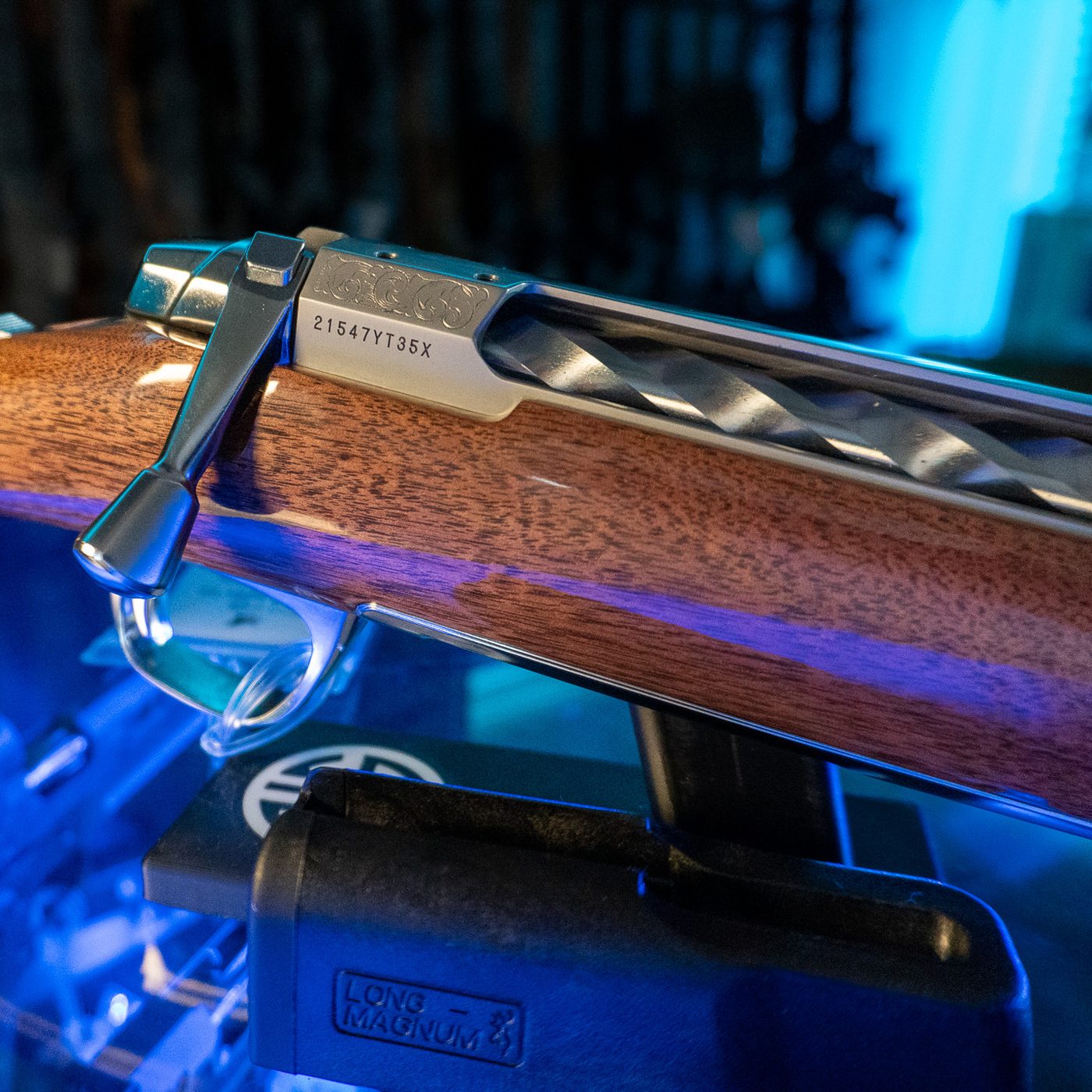 Browning X-Bolt 2 White Gold Medallion close-up of the scroll engraved stainless receiver, spiral fluted bolt and gold-plated trigger