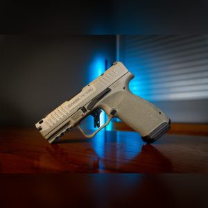 Canik METE MC9 Prime 9mm micro-compact pistol in Bullshark with compensated slide, flat aluminum trigger and stippled grip, left side