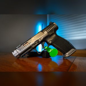 Canik TTI Combat Smoke 9mm pistol with gray Cerakote ported slide, bronze barrel in the ports, compensator and gray aluminum magwell, left side