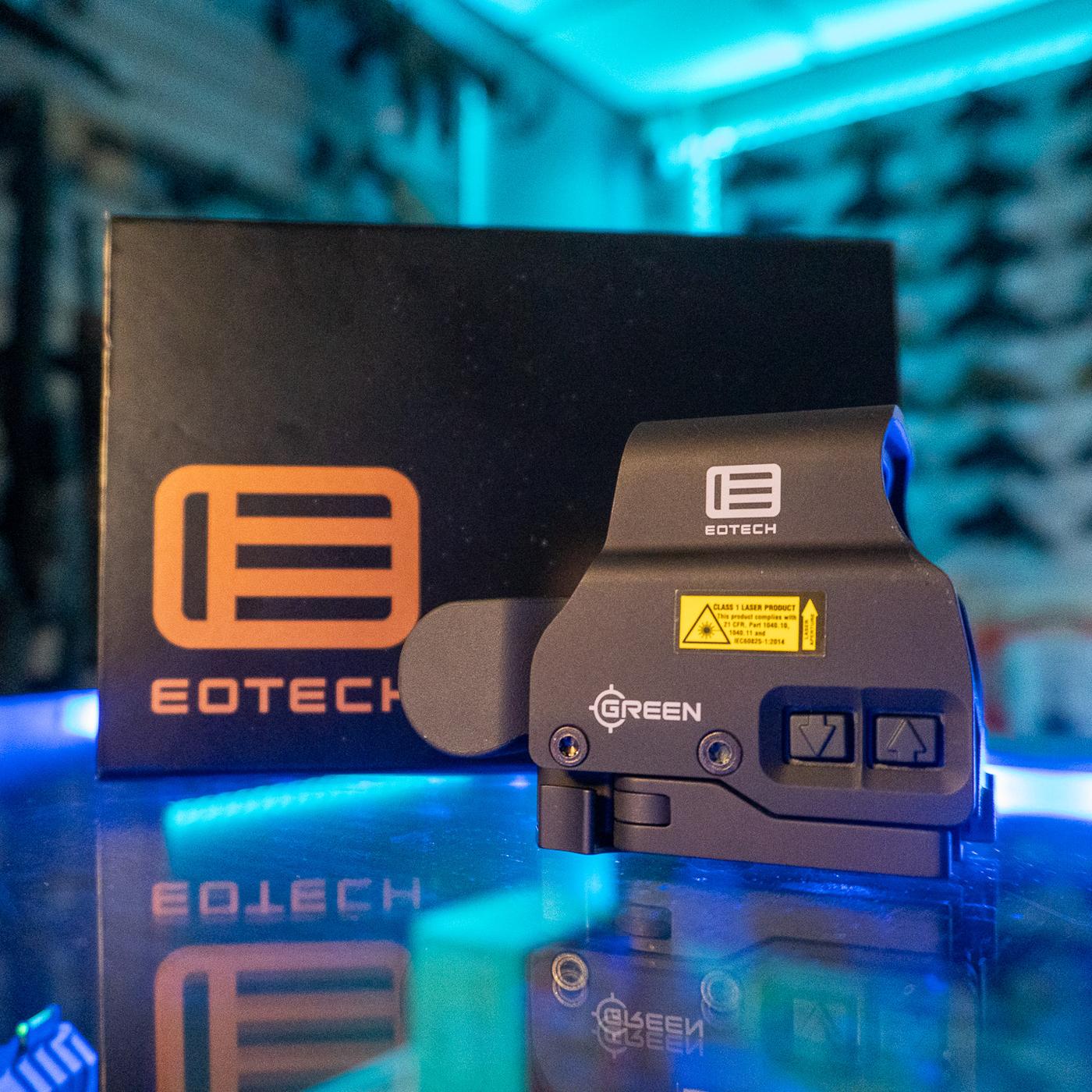 EOTech EXPS2-0 green reticle holographic weapon sight with side buttons and quick-detach lever in front of its box