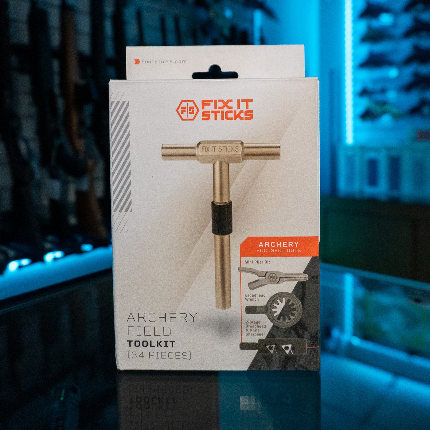 Fix It Sticks Archery Field Toolkit 34-piece kit in its retail box on a glass store counter