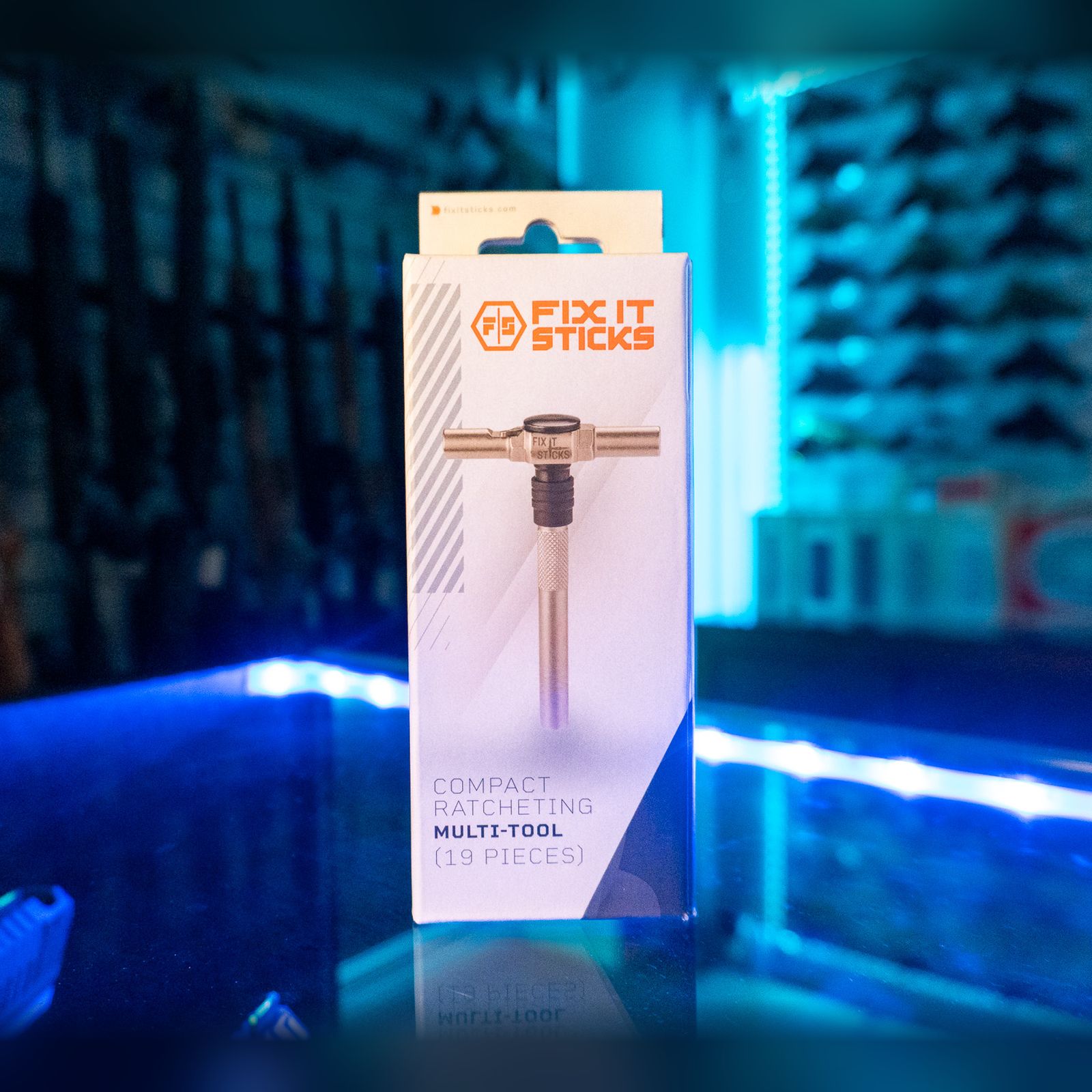 Fix It Sticks Compact Ratcheting Multi-Tool 19-piece set in its retail box on a glass store counter