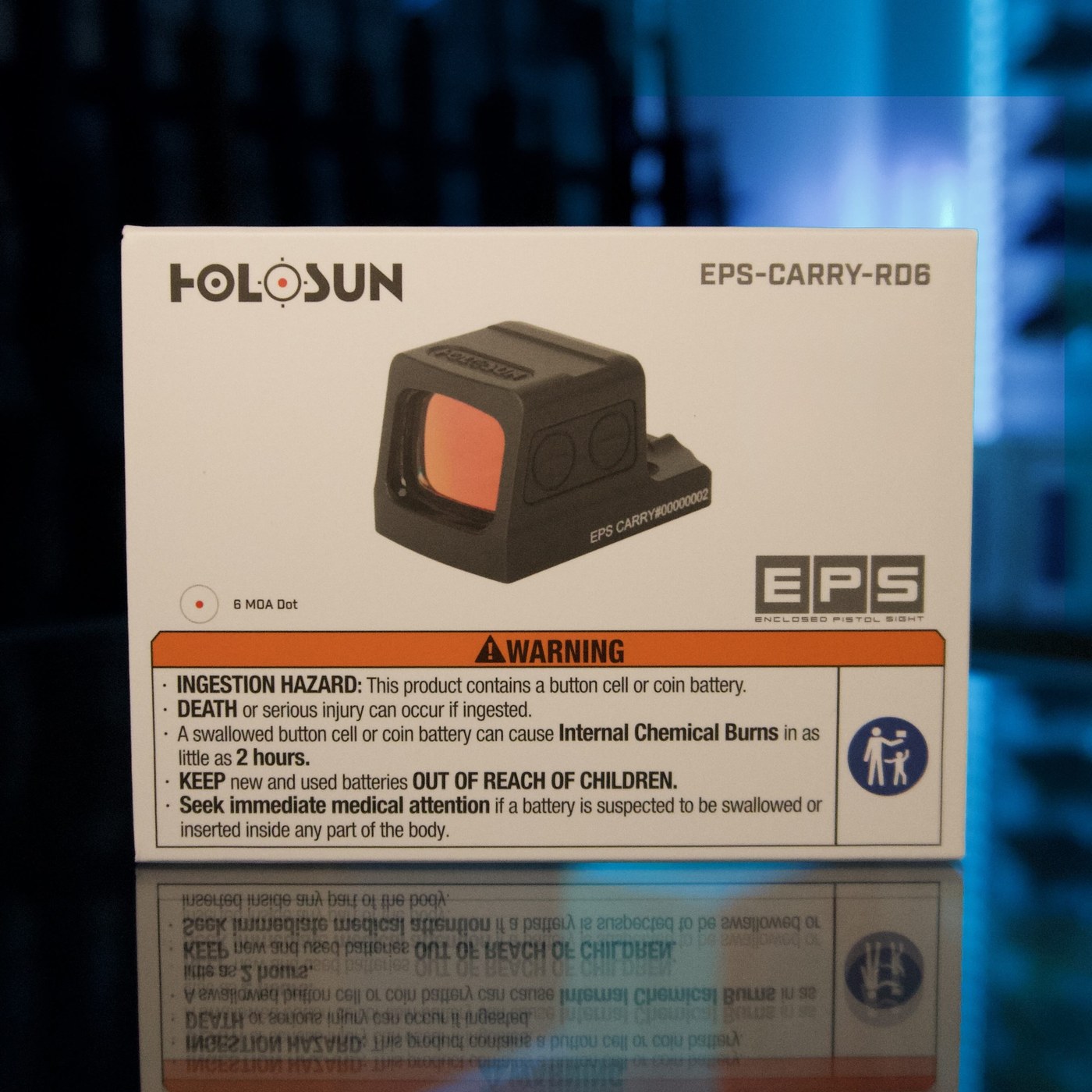 Holosun EPS Carry enclosed red dot pistol sight with 6 MOA dot, retail box on a glass display counter