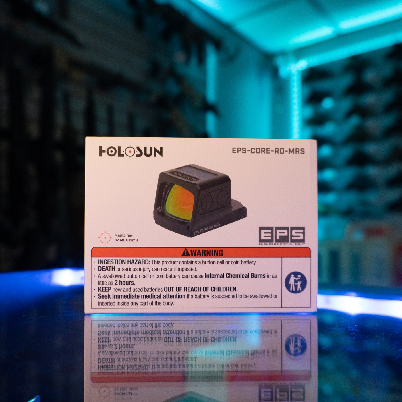 Holosun EPS-CORE-RD-MRS enclosed red multi-reticle pistol sight in its retail box on a glass display counter
