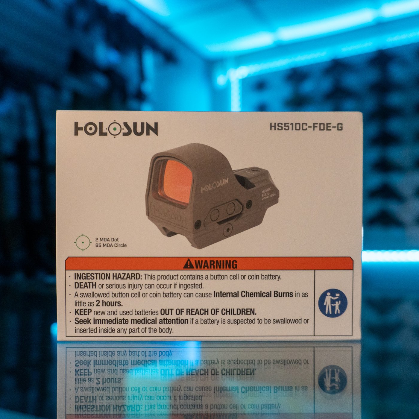 Holosun HS510C open reflex green dot sight in flat dark earth, retail box on a glass display counter
