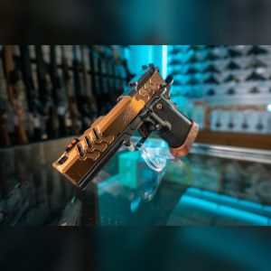 Front angle of the Kimber 2K11 Pro Comp Coyote with integrated compensator ports and fiber optic front sight