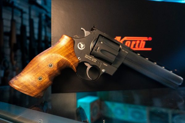 Korth Mongoose 8-Shot .357 Magnum revolver, left side with finger-groove walnut grip, fluted eight-round cylinder and ventilated rib
