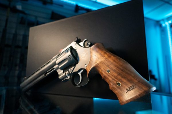 Korth Mongoose 8-Shot revolver closeup of right side, adjustable rear sight, cylinder and walnut grip with Korth logo
