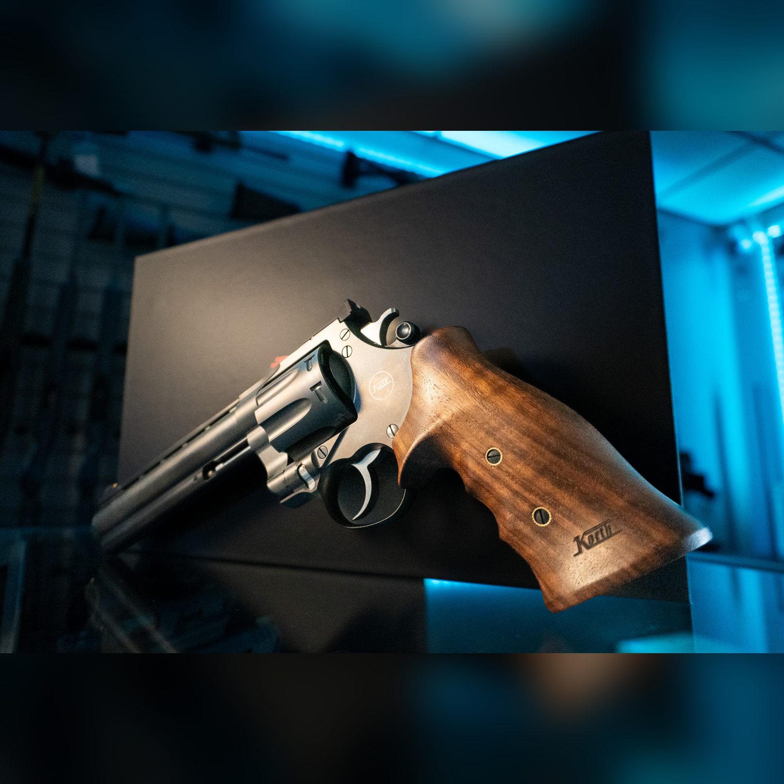 Korth Mongoose 8-Shot revolver closeup of right side, adjustable rear sight, cylinder and walnut grip with Korth logo