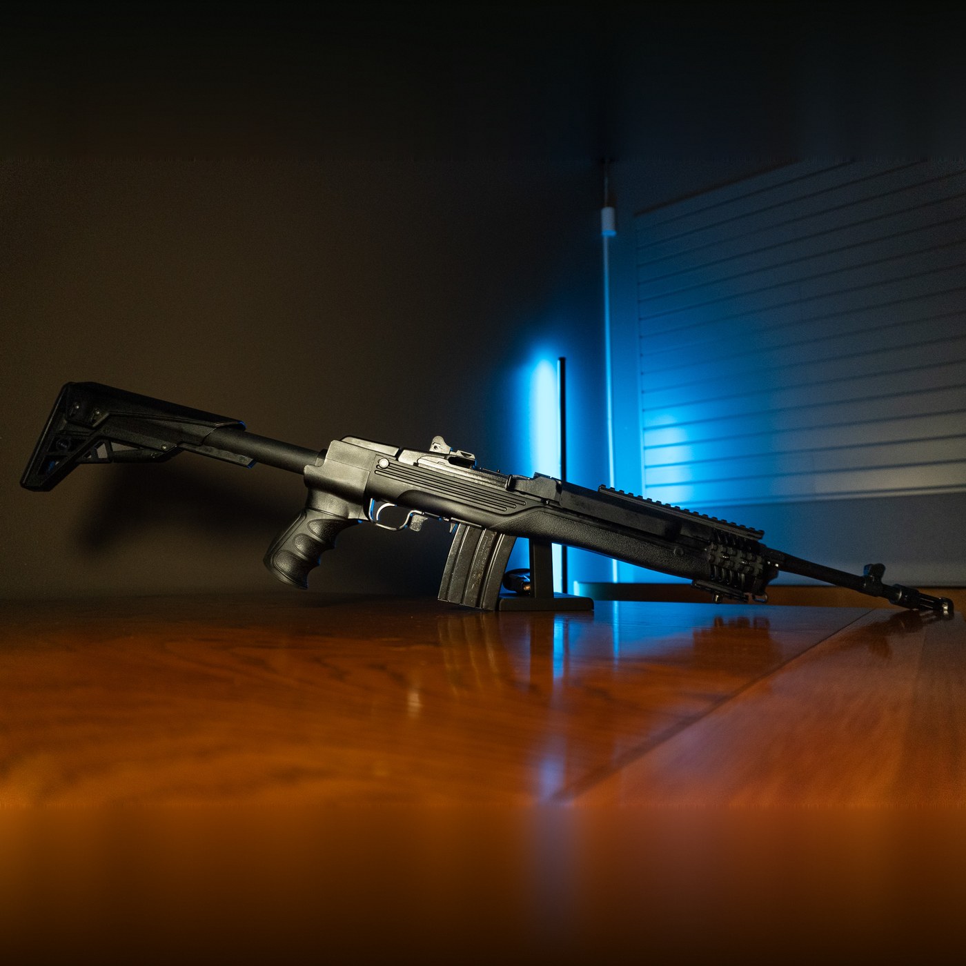 Ruger Mini-14 Tactical 5.56 NATO rifle with black ATI Strikeforce folding stock and 16.12 inch barrel with flash suppressor