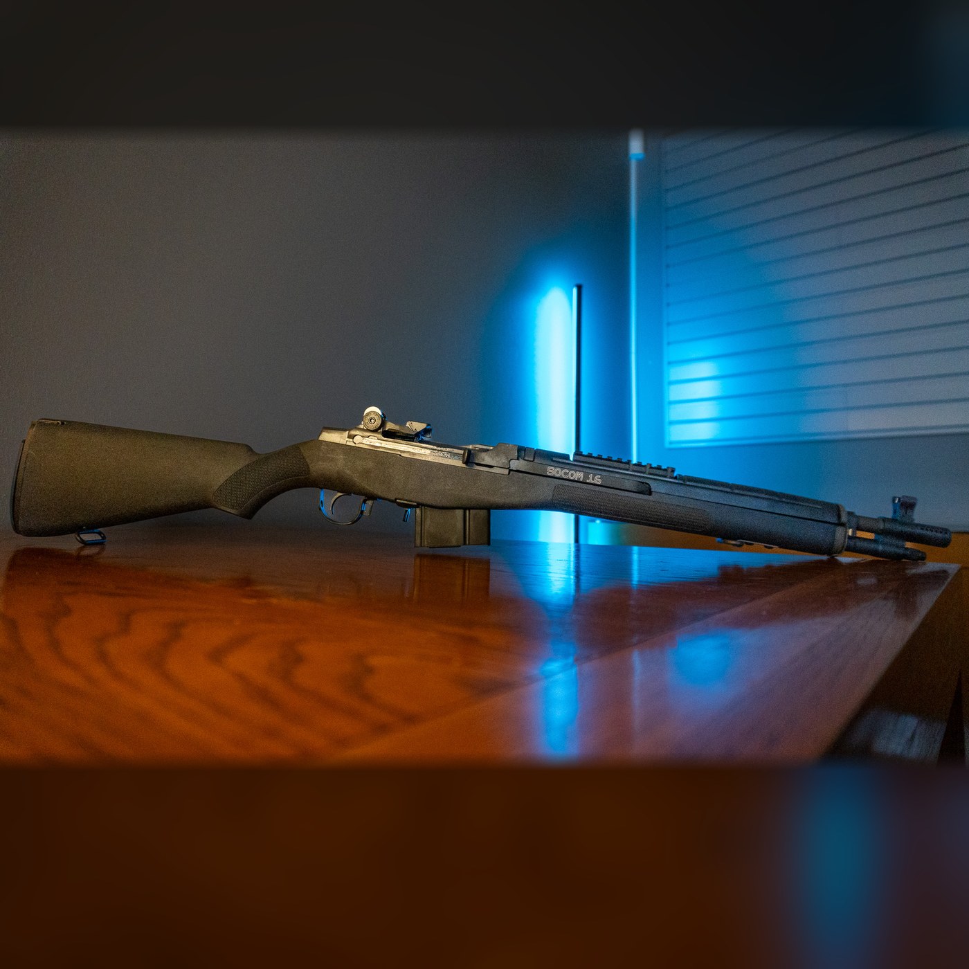 Springfield Armory M1A SOCOM 16 .308 rifle, left side, black composite stock, 16.25 inch barrel with muzzle brake and forward scout Picatinny rail