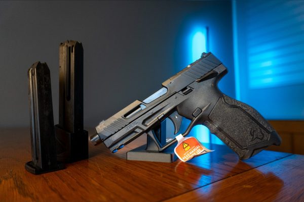 Taurus TX22 Gen 2 TORO .22 LR pistol in black with threaded barrel and optic-ready slide, left side, with 22-round and 16-round magazines