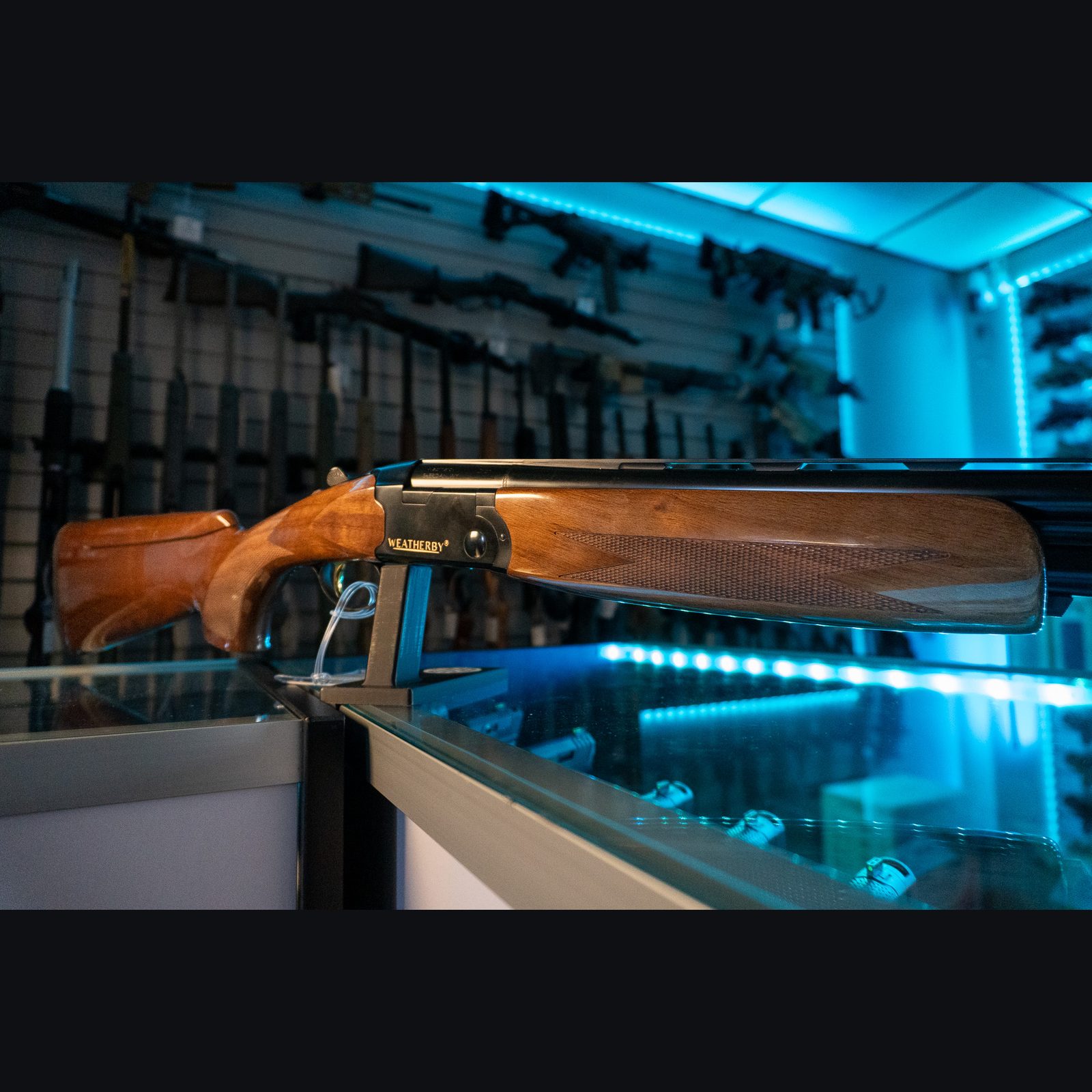 Weatherby Orion Sporting 12 gauge over/under shotgun with gloss walnut stock and checkered forend, right side